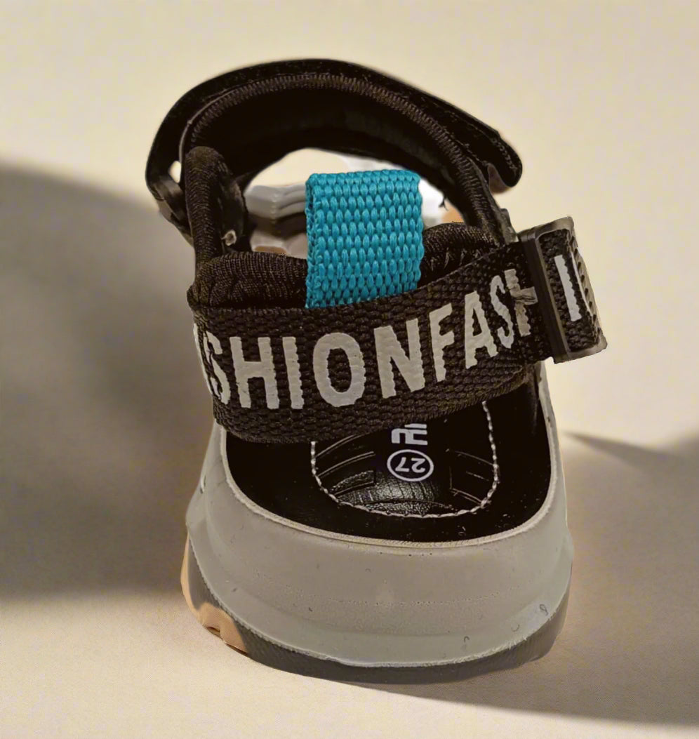 Child's sandal with 'Fashionfast' branding on a white background