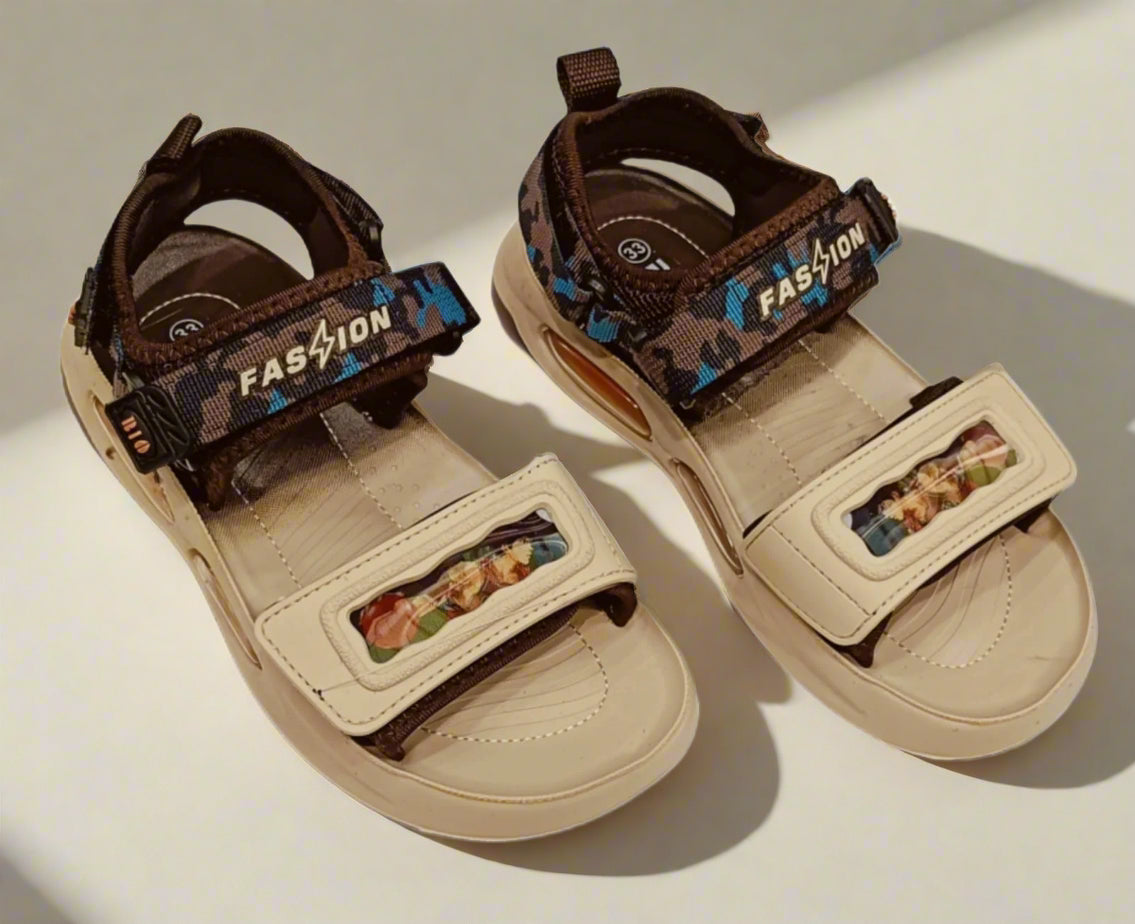 Pair of children's sandals with brown straps and beige soles on a white background