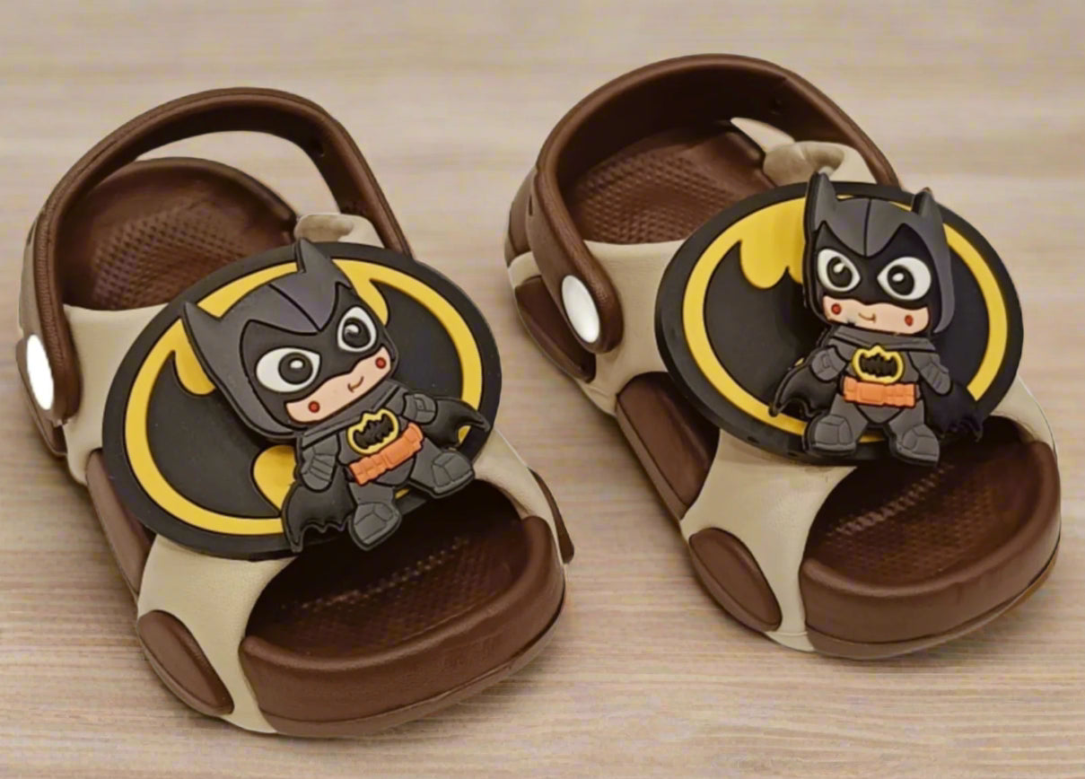 Pair of children's sandals with Batman character design on a white background