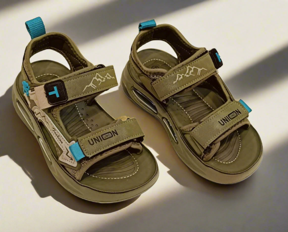 Pair of olive sandals with blue straps on a white background