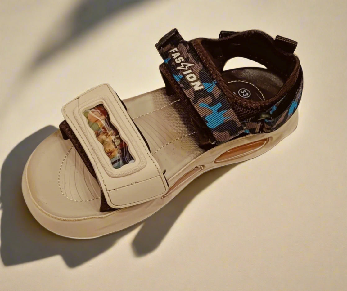 Beige sandal with brown strap on a white background